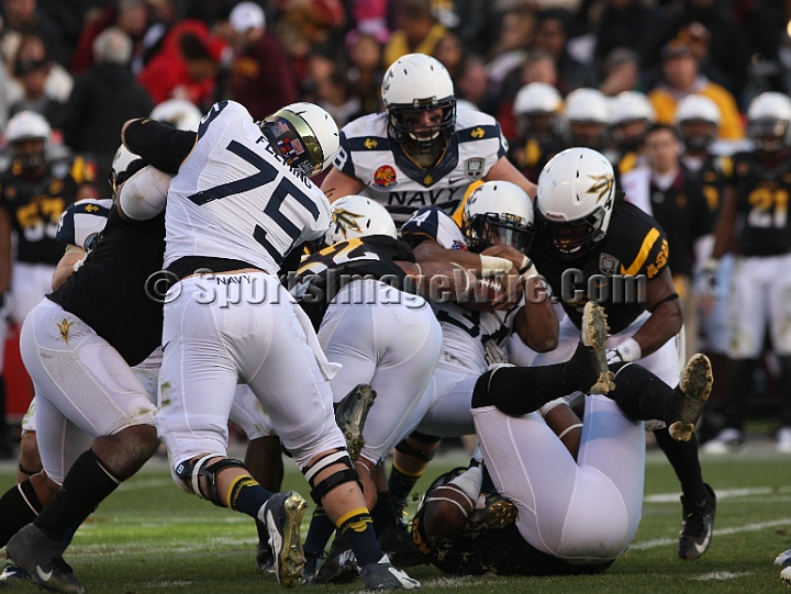 122912 Kraft SA-059.JPG - Dec 29, 2012; San Francisco, CA, USA; Navy Midshipmen  full back Noah Greene (34) is tackled against the Arizona State Sun Devils in the 2012 Kraft Fighting Hunger Bowl at AT&T Park.
